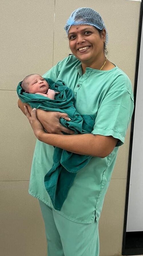 Dr. Shyamala M with a newborn baby after successful delivery